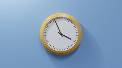 Glossy orange clock on a blue wall at fifty-six past three. Time is 03:56 or 15:56