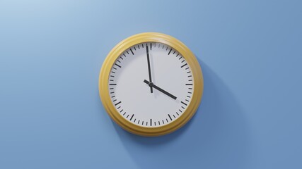 Glossy orange clock on a blue wall at fifty-nine past three. Time is 03:59 or 15:59