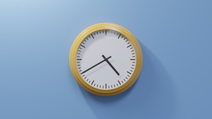 Glossy orange clock on a blue wall at twenty to five. Time is 04:40 or 16:40