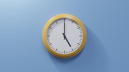 Glossy orange clock on a blue wall at five o'clock. Time is 05:00 or 17:00