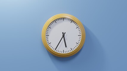 Glossy orange clock on a blue wall at thirty-five past five. Time is 05:35 or 17:35