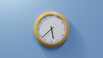 Glossy orange clock on a blue wall at thirty-eight past five. Time is 05:38 or 17:38