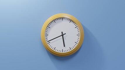 Glossy orange clock on a blue wall at forty-one past five. Time is 05:41 or 17:41