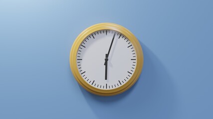 Glossy orange clock on a blue wall at three past six. Time is 06:03 or 18:03