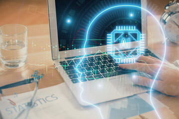 Man typing on keyboard background with brain hologram. Concept of big Data.