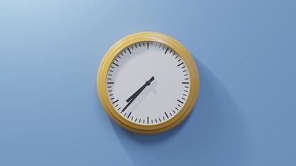 Glossy orange clock on a blue wall at thirty-seven past seven. Time is 07:37 or 19:37