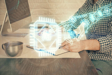 Businessman working on DeskTop with technology theme drawing. Concept of big data. Double exposure.