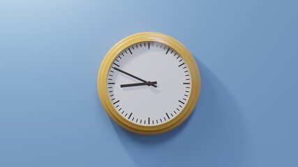 Glossy orange clock on a blue wall at forty-nine past eight. Time is 08:49 or 20:49