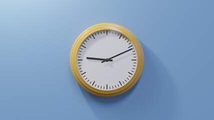 Glossy orange clock on a blue wall at eleven past nine. Time is 09:11 or 21:11