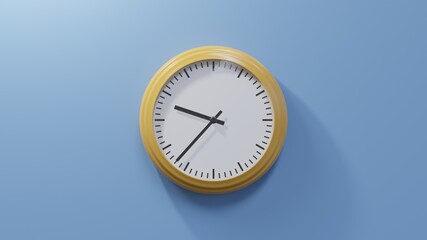 Glossy orange clock on a blue wall at thirty-seven past nine. Time is 09:37 or 21:37