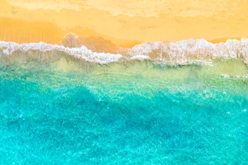 Rolgordijnen Top view aerial drone photo of ocean seashore with beautiful turquoise water and sea waves. Caribbean resort. Vacation travel background. © Nikolay N. Antonov