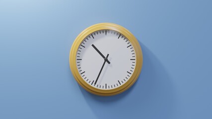 Glossy orange clock on a blue wall at thirty-four past ten. Time is 10:34 or 22:34