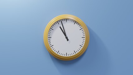Glossy orange clock on a blue wall at fifty-seven past ten. Time is 10:57 or 22:57