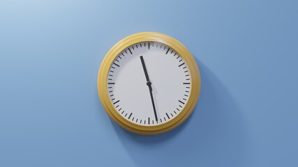 Glossy orange clock on a blue wall at twenty-eight past eleven. Time is 11:28 or 23:28