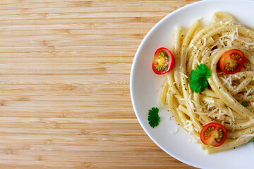 Spaghetti with cherry tomatoes and cheese copyspace