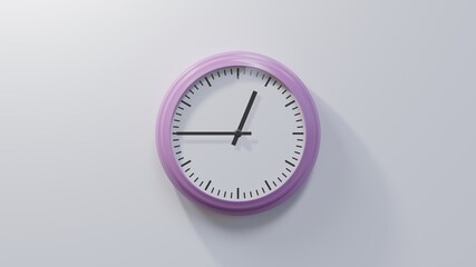 Glossy pink clock on a white wall at quarter to one. Time is 00:45 or 12:45