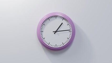 Glossy pink clock on a white wall at fourteen past one. Time is 01:14 or 13:14