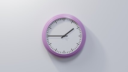 Glossy pink clock on a white wall at quarter to two. Time is 01:45 or 13:45