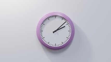 Glossy pink clock on a white wall at eight past two. Time is 02:08 or 14:08