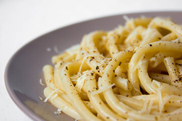 Spaghetti with cheese and pepper close-up