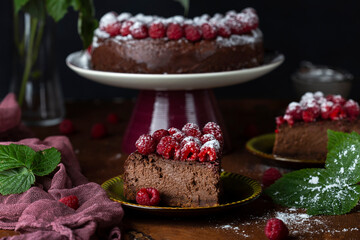 delicious homemade Chocolate cheesecake with fresh raspberries