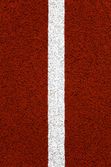 Fototapeta na wymiar Red stadium running track closeup