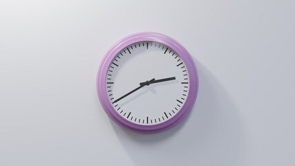 Glossy pink clock on a white wall at twenty to three. Time is 02:40 or 14:40