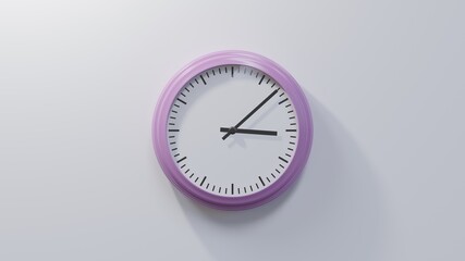 Glossy pink clock on a white wall at eight past three. Time is 03:08 or 15:08