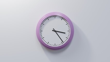 Glossy pink clock on a white wall at twenty-four past three. Time is 03:24 or 15:24