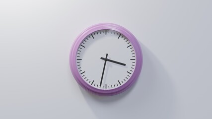 Glossy pink clock on a white wall at thirty-two past three. Time is 03:32 or 15:32