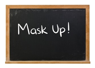 Fototapeta premium Mask up written in white chalk on a black chalkboard isolated on white