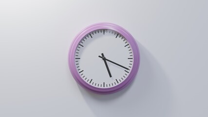 Glossy pink clock on a white wall at nineteen past five. Time is 05:19 or 17:19