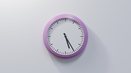 Glossy pink clock on a white wall at twenty-five past five. Time is 05:25 or 17:25