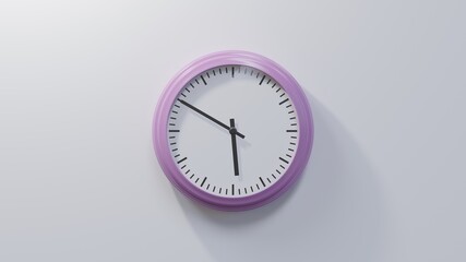 Glossy pink clock on a white wall at ten to six. Time is 05:50 or 17:50
