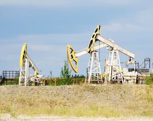 Oil pumping unit at the site of hydrocarbon production. The sucker rod pump is stopped