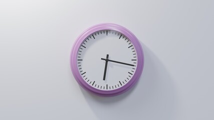 Glossy pink clock on a white wall at seventeen past six. Time is 06:17 or 18:17