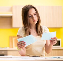 Young woman wife in budget planning concept