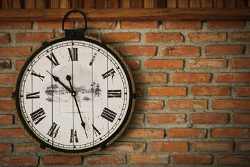 Fototapeta na wymiar old clocks on the brick wall - time, time change, timeless