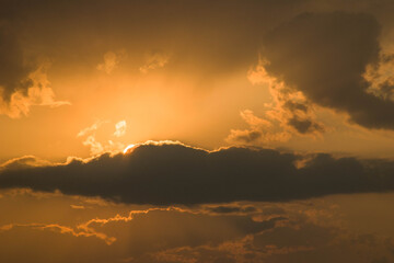 The sun at sunset and, slightly covering it, clouds (option 5)