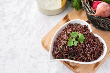 space organic red rice with vegetable food background