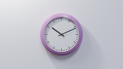 Glossy pink clock on a white wall at eleven past ten. Time is 10:11 or 22:11