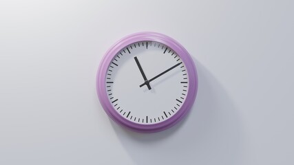 Glossy pink clock on a white wall at ten past eleven. Time is 11:10 or 23:10