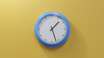 Glossy blue clock on a orange wall at twenty-seven past one. Time is 01:27 or 13:27