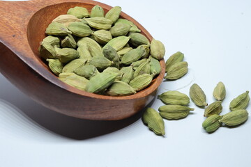 Green Dried cardamom seeds isolated on white background