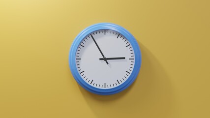 Glossy blue clock on a orange wall at five to three. Time is 02:55 or 14:55