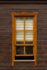 Close up taken of half open window made of wood.