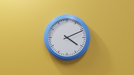 Glossy blue clock on a orange wall at eleven past four. Time is 04:11 or 16:11