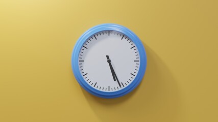 Glossy blue clock on a orange wall at twenty-six past five. Time is 05:26 or 17:26