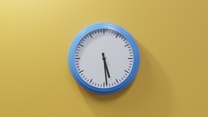 Glossy blue clock on a orange wall at twenty-nine past five. Time is 05:29 or 17:29