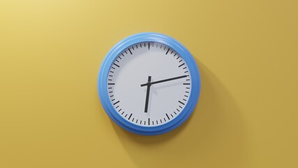 Glossy blue clock on a orange wall at thirteen past six. Time is 06:13 or 18:13